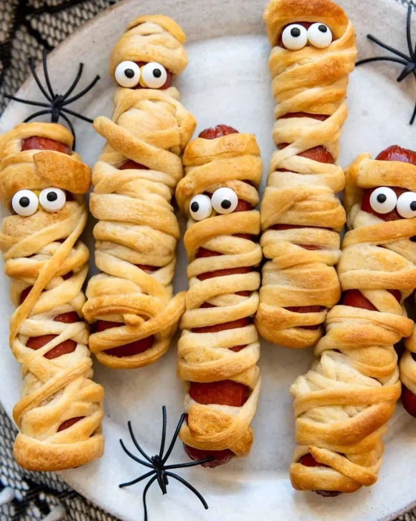 17 Halloween Finger Food Ideas for a Spooky Party Everyone Will Love 4 Halloween Mummy Hot Dogs