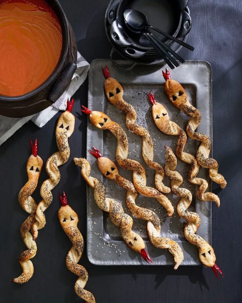 17 Halloween Finger Food Ideas for a Spooky Party Everyone Will Love 6 Spooky Snake Breadsticks